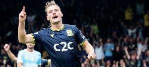 MAKING HIS POINT: Scott-Morriss enjoys scoring his side’s second goal PICTURE: Focus Images