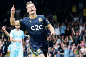 MAKING HIS POINT: Scott-Morriss enjoys scoring his side’s second goal PICTURE: Focus Images