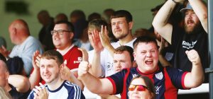 SING WHEN WE’RE WINNING: Merthyr Town fans in full voice after their Southern League Premier South success PICTURE: Julia Urwin