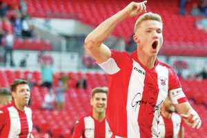 Gaz Dean wheels away after scoring for Brackley Town in the FA Trophy final at Wembley in 2018