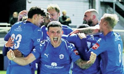 Billericay Town players celebrate their replay victory over Hednesford Town