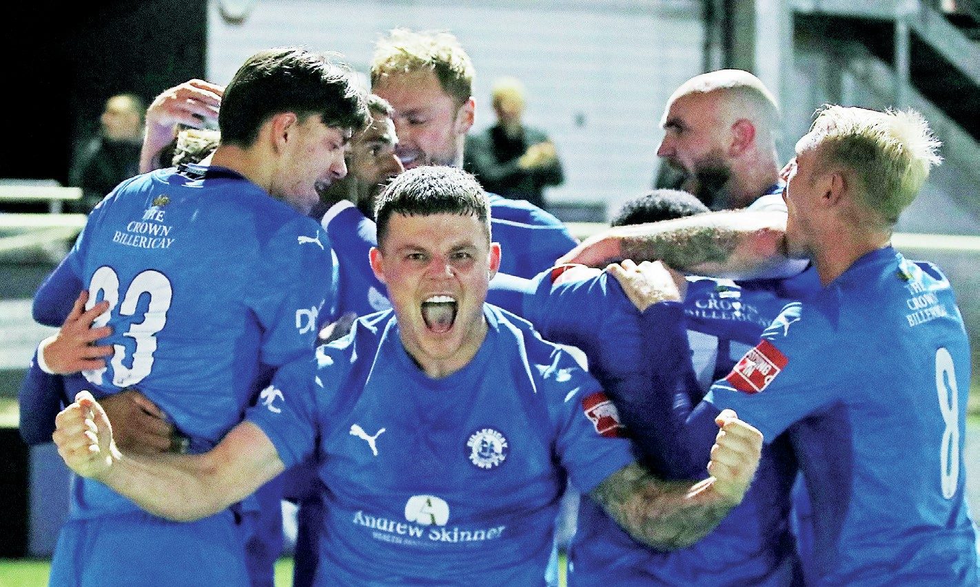 Billericay Town players celebrate their replay victory over Hednesford Town