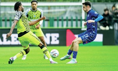 Forest Green’s James Balagizi, left, gets to the ball before Rochdale’s Connor McBride