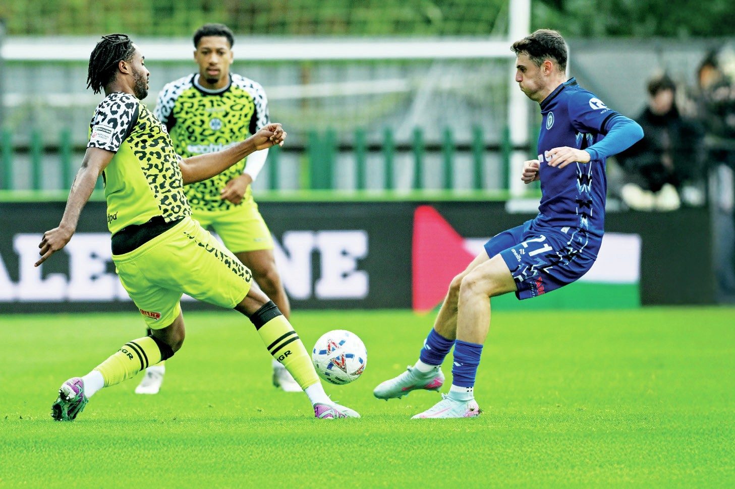 Forest Green’s James Balagizi, left, gets to the ball before Rochdale’s Connor McBride
