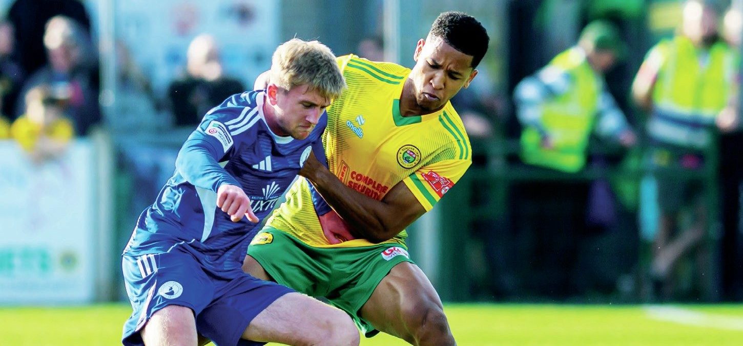 Runcorn Linnets’ Joseph Ferguson gets to grips with Buxton’s Luke Brennan