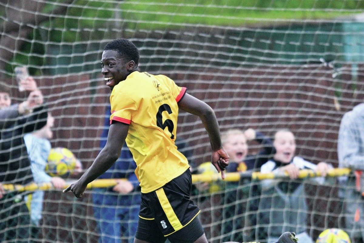 ALL SMLES: Thomas Conteh fires into an empty net for Alvechurch’s second goal