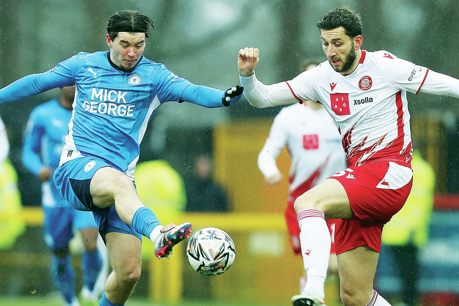 Chris Conn-Clarke competes for the ball for Peterborough United