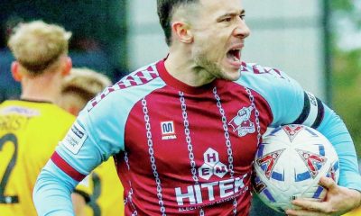 Callum Roberts celebrates his match-saving penalty with travelling Scunthorpe fans