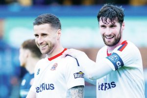 Fylde skipper Corey Whelan congratulates Ryan Colcough