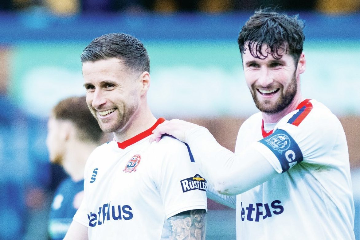 Fylde skipper Corey Whelan congratulates Ryan Colcough