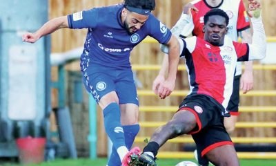 Rochdale’s Tarryn Allarakhia is challenged by Woking’s Timmy Akinola