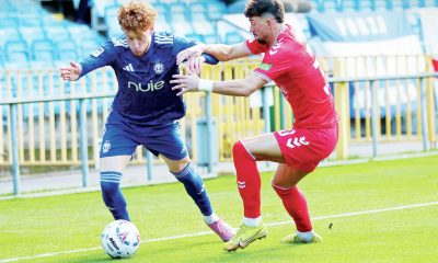 Owen Bray, left, takes on York City’s Alex Newby