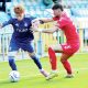 Owen Bray, left, takes on York City’s Alex Newby