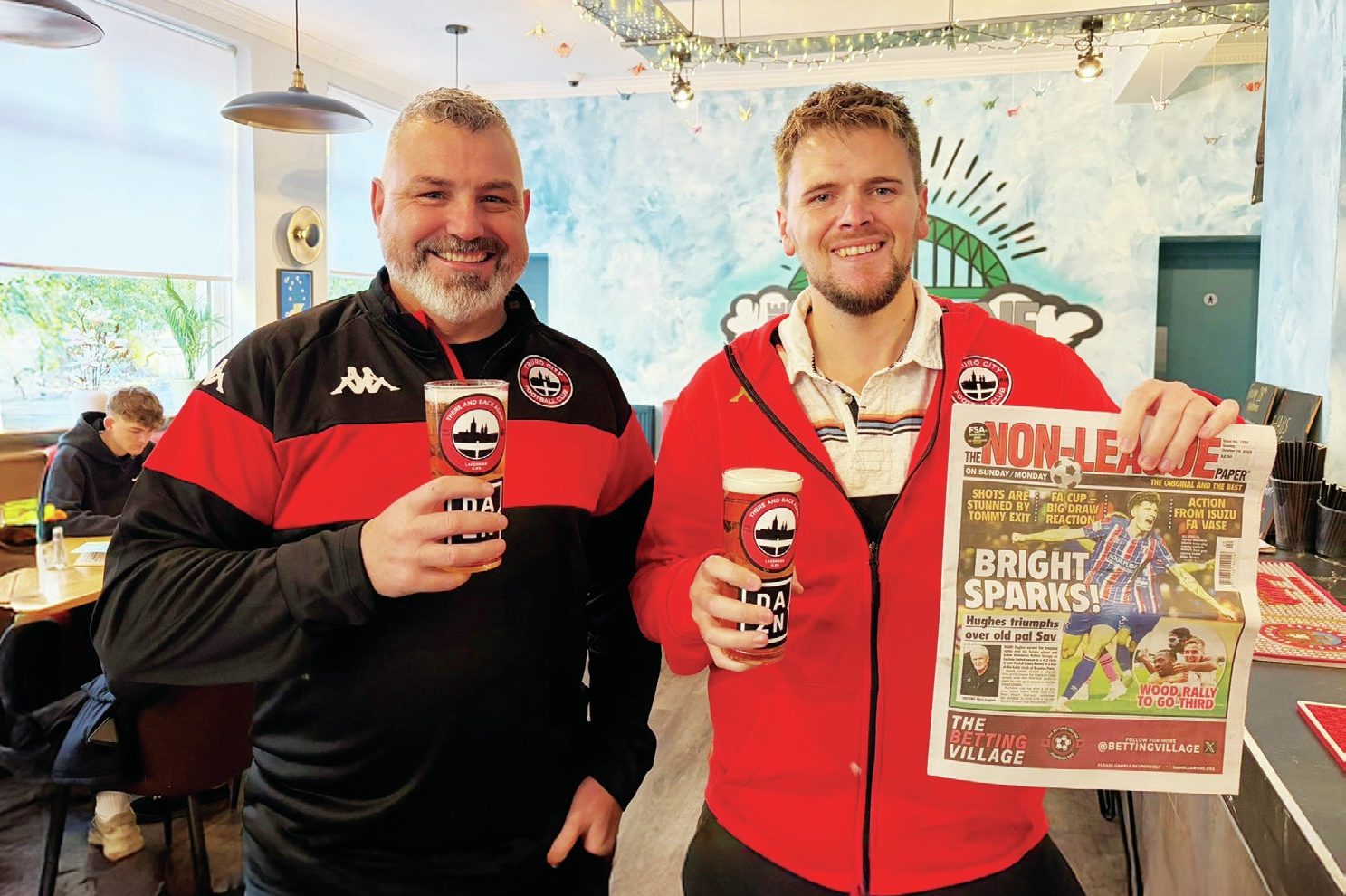 These dedicated Truro City fans were happy to take The NLP and DAZN up on their free pint offer