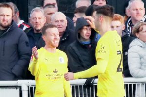 Elliot Newby celebrates his goal for Barrow
