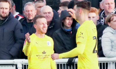 Elliot Newby celebrates his goal for Barrow