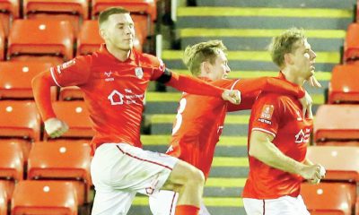 Marc Roberts, right, wheels away after scoring Barnsley’s winner