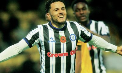 Tyler Smith wheels away after his brace helped continue Rochdale’s title charge