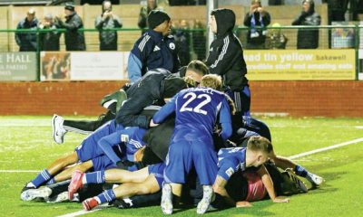 Connor Kirby celebrates scoring Buxton’s late winner against Chatham and is mobbed by team mates