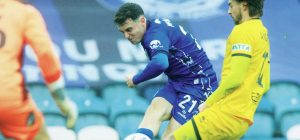 Conor McBride gets a shot off for Rochdale