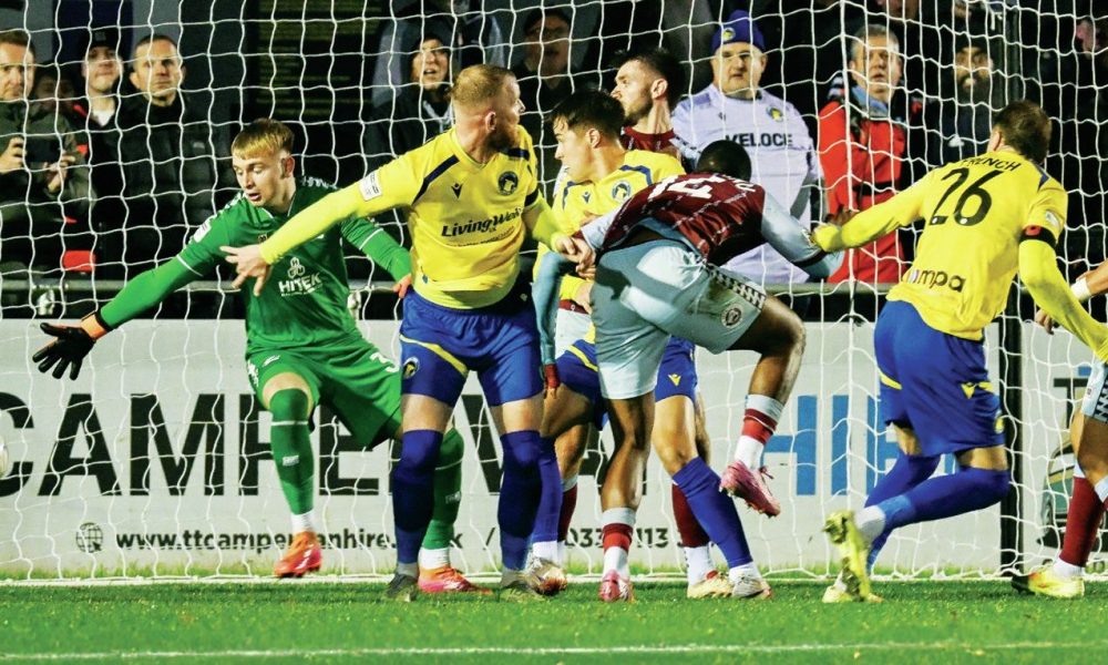 Solihull Moors’ Tyler French heads home the final goal of the game to make it 3-0