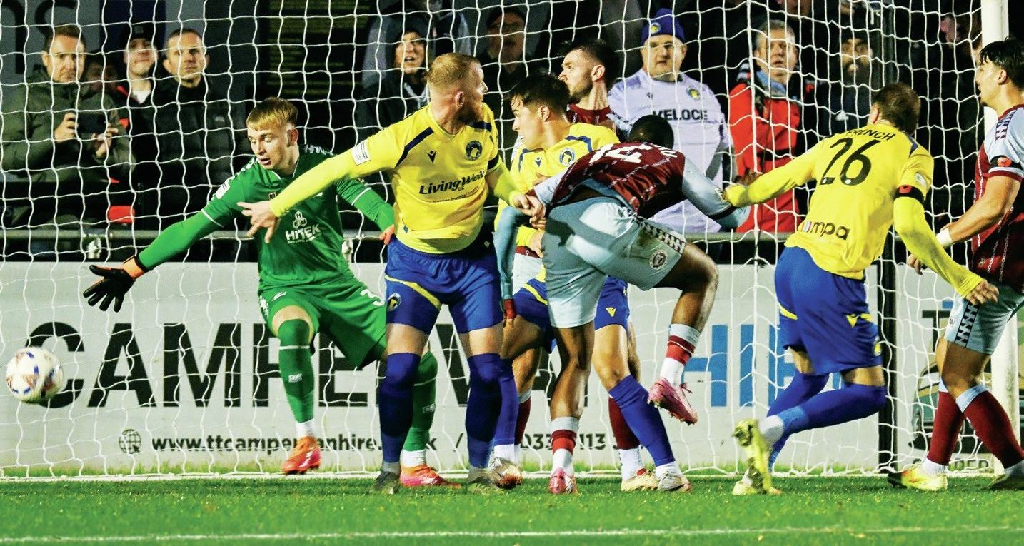 Solihull Moors’ Tyler French heads home the final goal of the game to make it 3-0