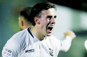 Sam Osborne celebrates after netting his third