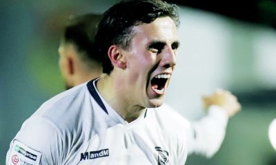 Sam Osborne celebrates after netting his third