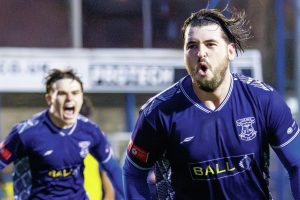 Leek Town’s Louis Potts wheels away after his goal