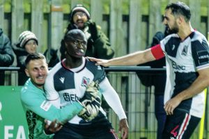 Cedric Main is mobbed by his Darlington team-mates
