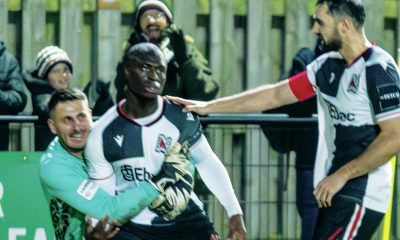 Cedric Main is mobbed by his Darlington team-mates