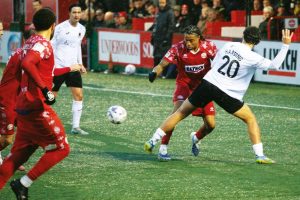 Horsham’s Lee Harding, No.20, attempts to halt a Hemel Hempstead attack