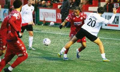 Horsham’s Lee Harding, No.20, attempts to halt a Hemel Hempstead attack