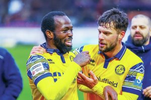 Woking’s Josh Osude, left, and Jack Turner celebrate victory