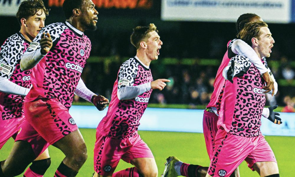 Forest Green Rovers midfielder Kyle McAllister runs away in celebration after making it 2-1