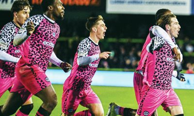 Forest Green Rovers midfielder Kyle McAllister runs away in celebration after making it 2-1