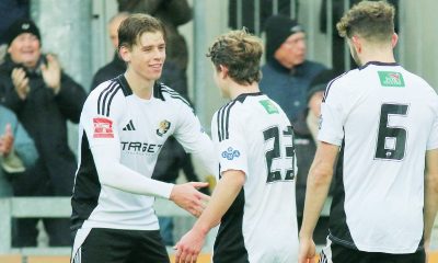 Sam Smith (far left) is congratulated by his team-mates for his goal