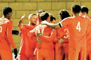 Rugby Borough’s Lindon Meikle is mobbed by team mates after scoring the winner