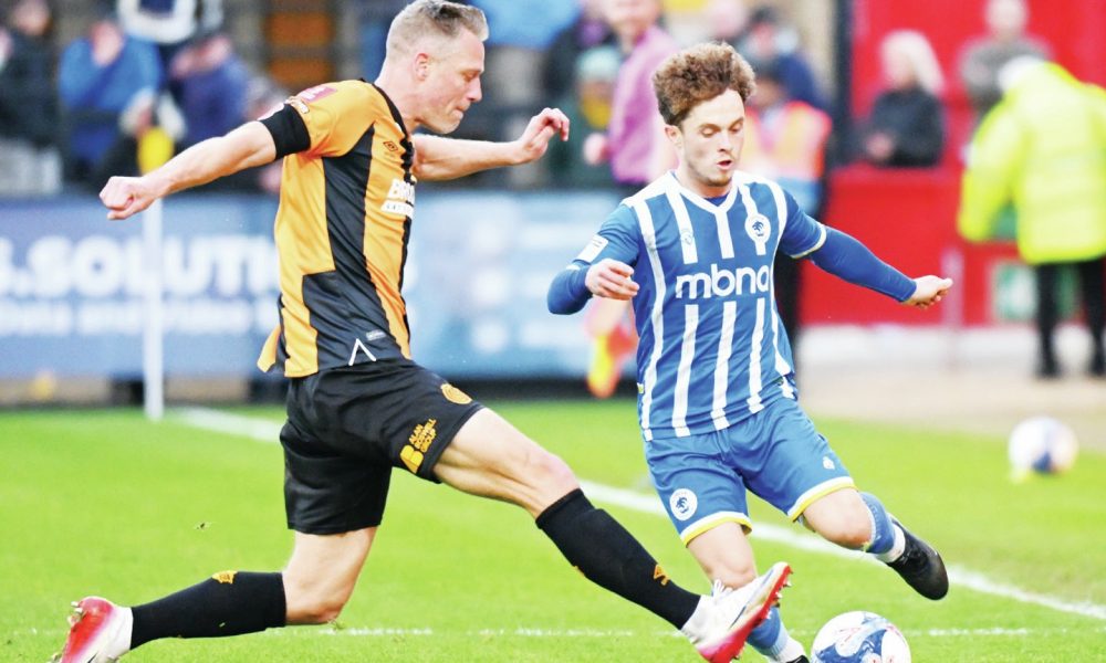 Chester’s Iwan Murray takes on Cambridge United’s Michael Morrison in their FA Cup tie