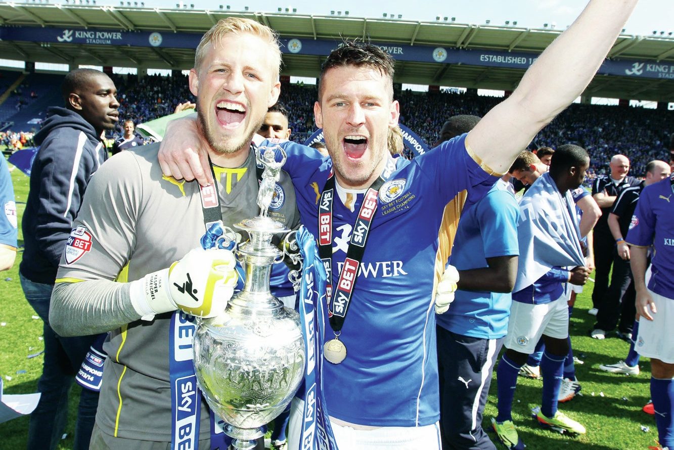 Leicester’s David Nugent and Kasper Schmeichel celebrate the Championship title in 2014