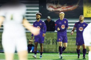 Harvey Slade, centre, enjoys his goal that makes it 3-0 to Poole