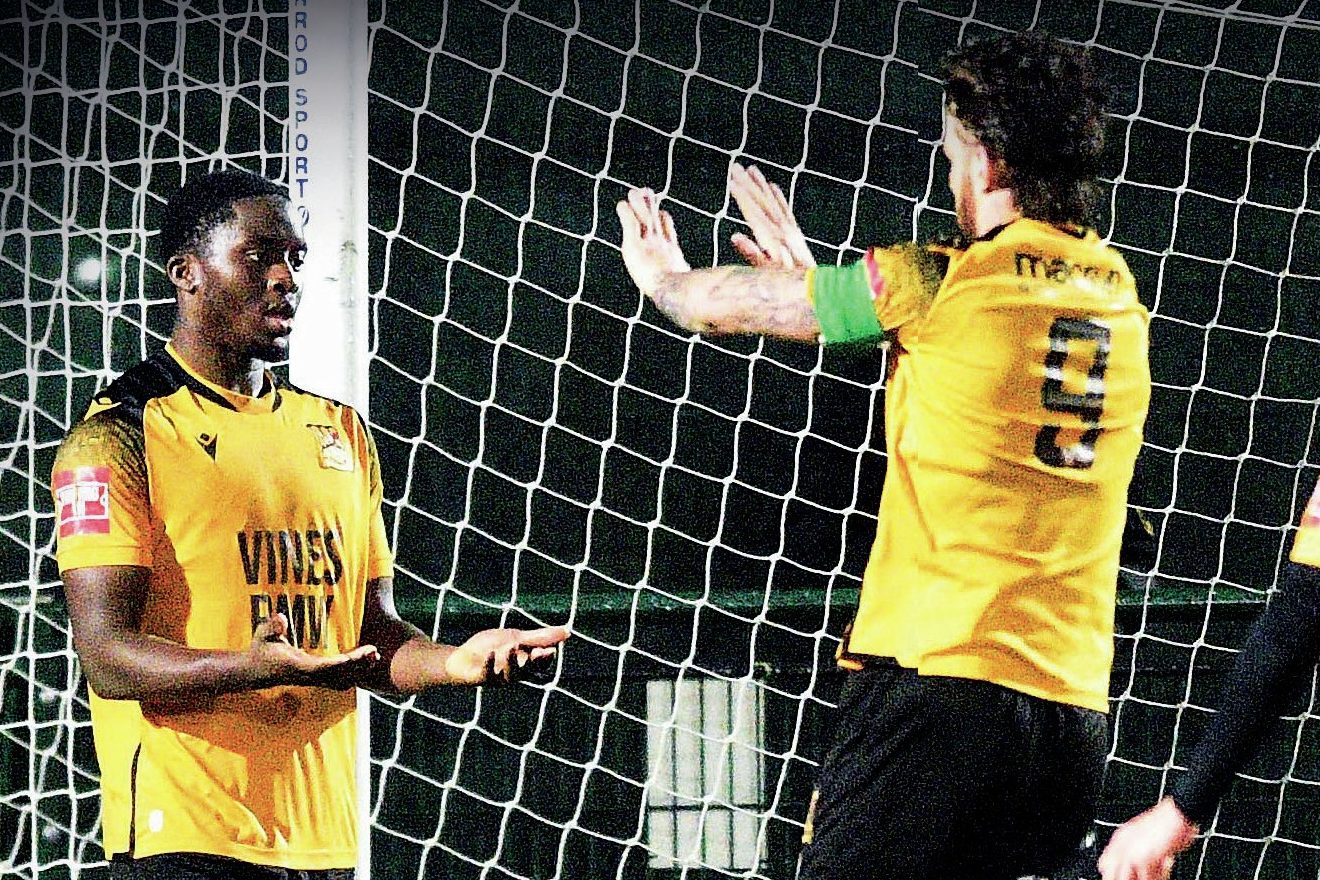Ade Adeyinka celebrates scoring his second goal for Three Bridges