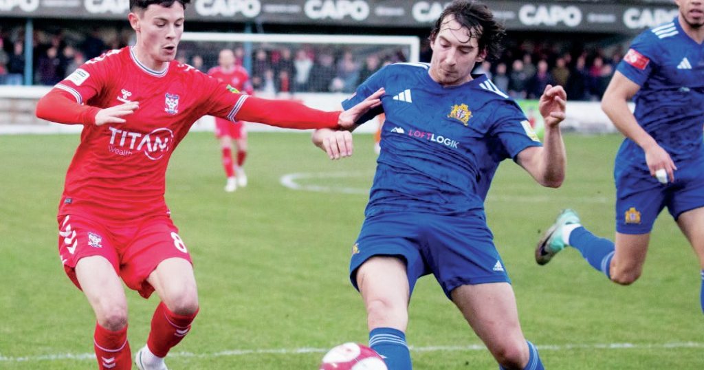 Clitheroe’s Cameron Lancaster clears the danger