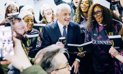 Kevin Keegan enjoys a pint while joining in with the carollers at Scunthorpe United, and inset