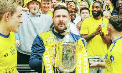Jamie Tompkins celebrates winning Isuzu FA Vase Final trophy with Ascot United in 2023