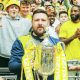 Jamie Tompkins celebrates winning Isuzu FA Vase Final trophy with Ascot United in 2023
