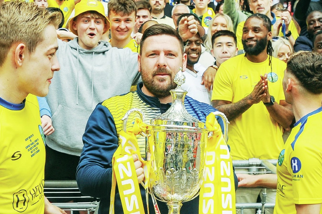 Jamie Tompkins celebrates winning Isuzu FA Vase Final trophy with Ascot United in 2023