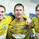 Nelson FC trio, L-R, Max Cane, Billy Priestley, and Finley Devenney celebrate victory over Ramsbottom in the last round