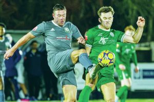 Biggleswade FC's Conner Inskip, right, challenges for the ball