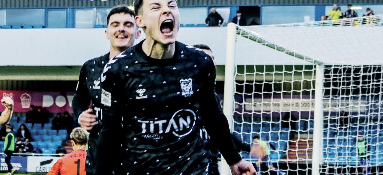 Alex Hunt wheels away after scoring from the spot for York City